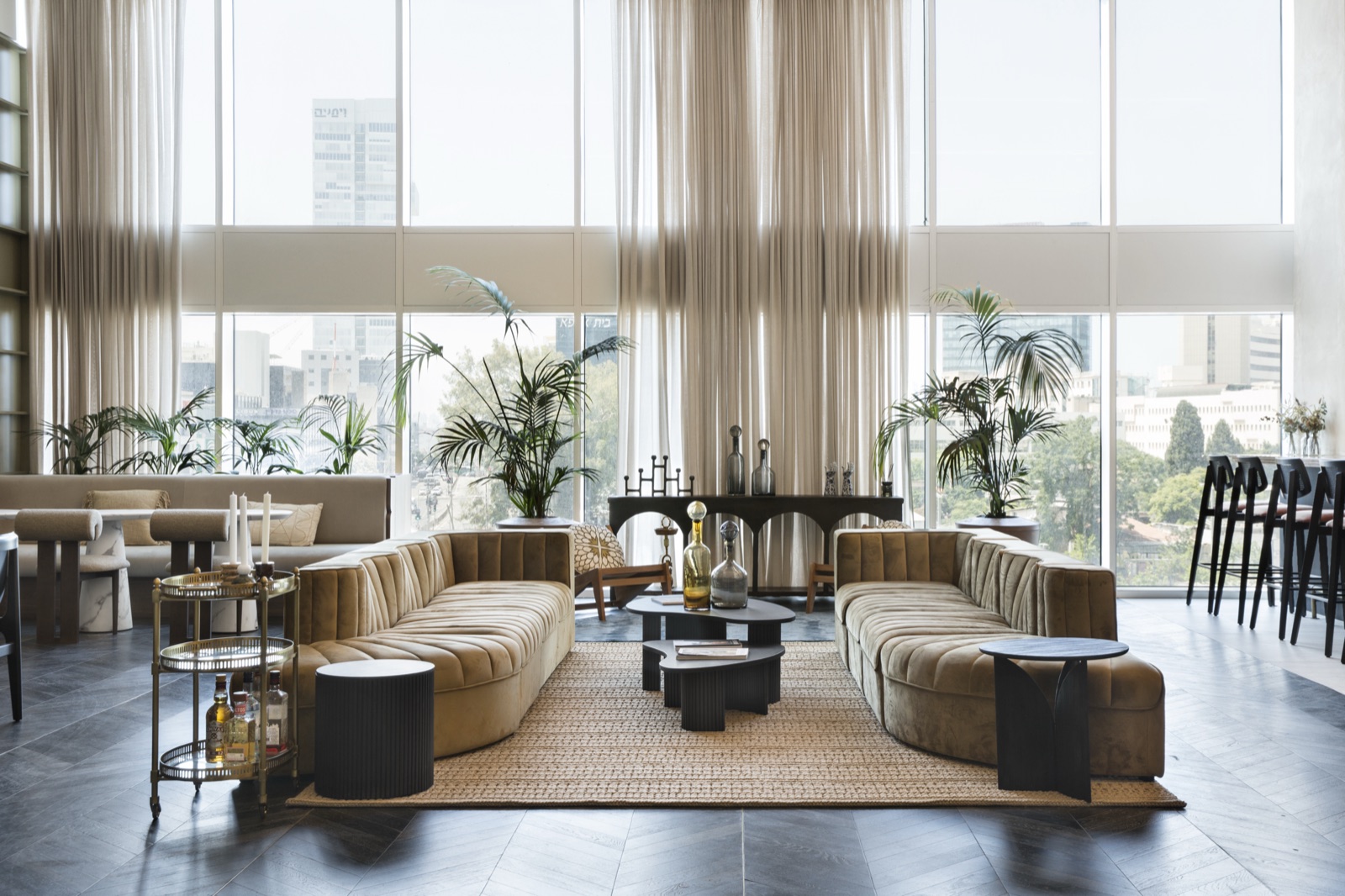 Double-height hotel lounge furnished by Hedom Living